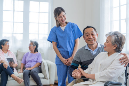 female caregiver assisting the adult couple