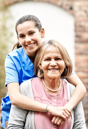 caregiver and senior smiling