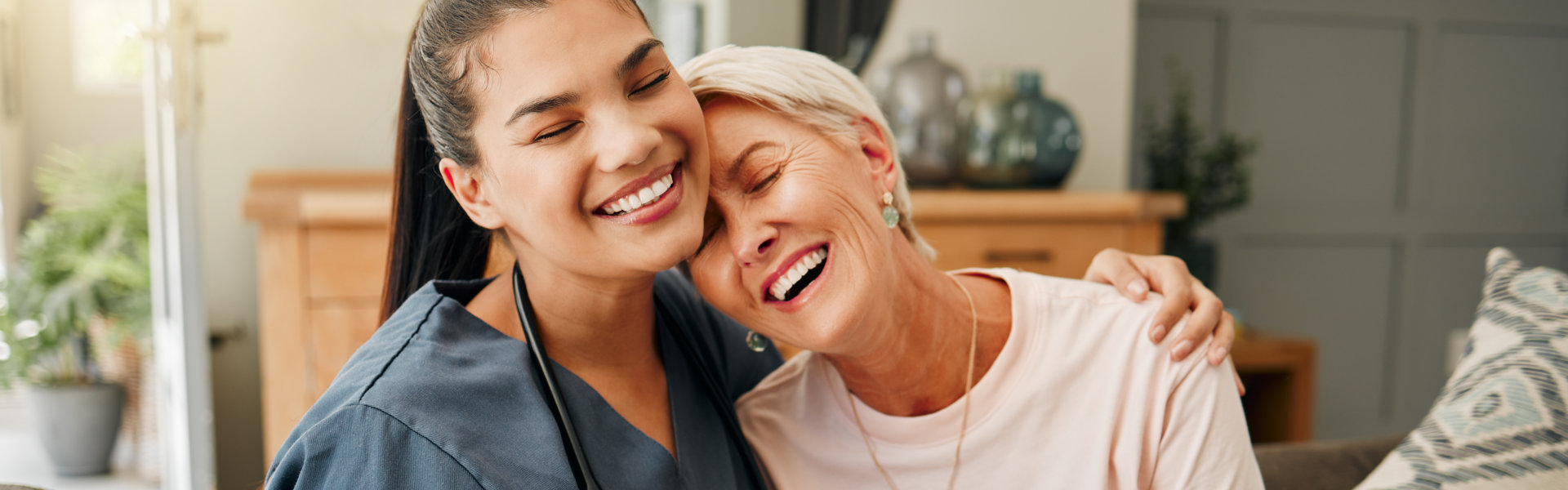 caregiver and senior laughing