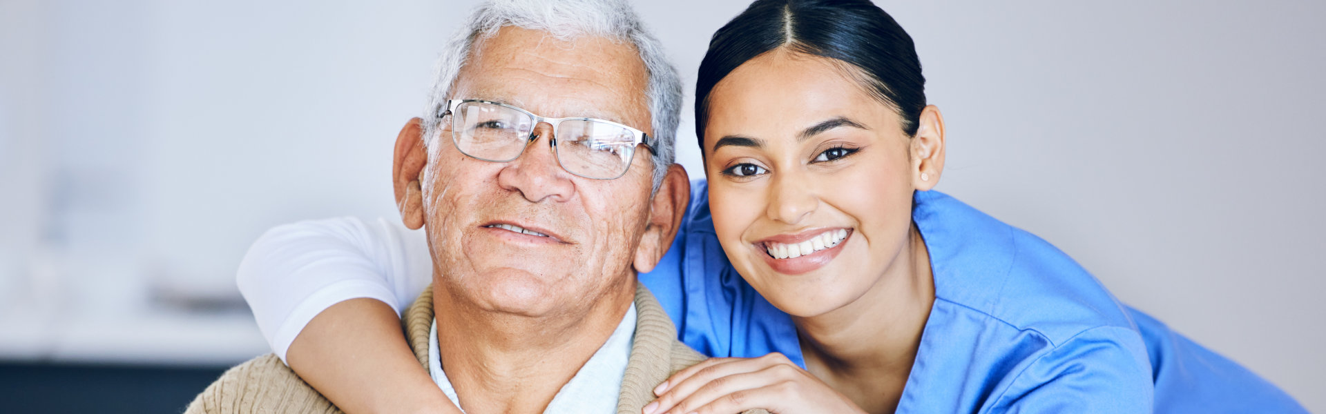 senior and caregiver smiling