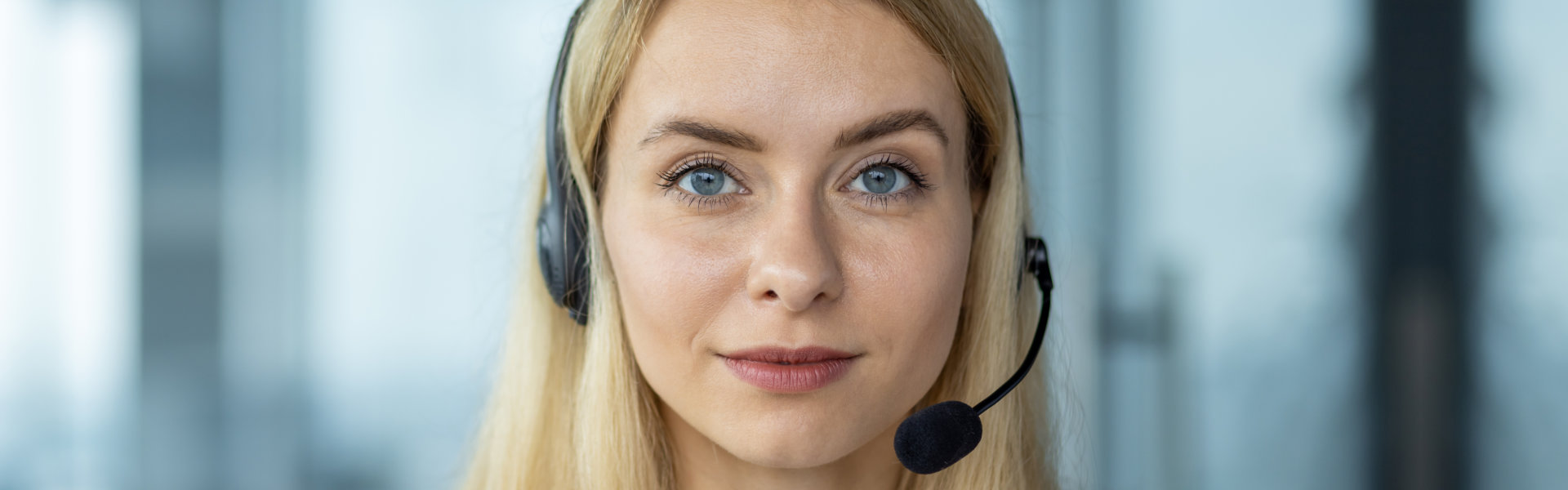 woman with headset smiling