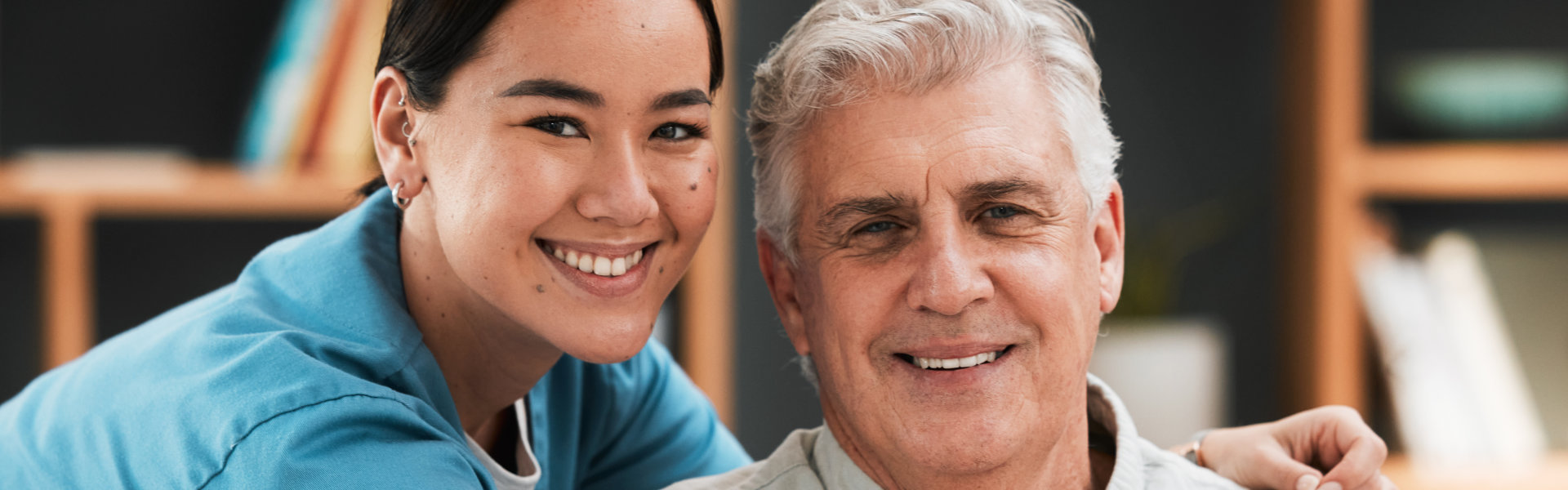 caregiver hugging senior